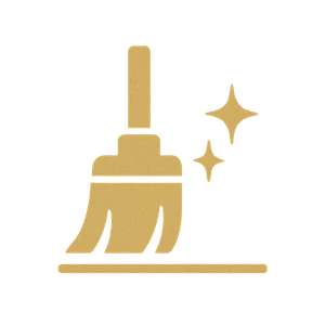 Gold icon of a broom with sparkles